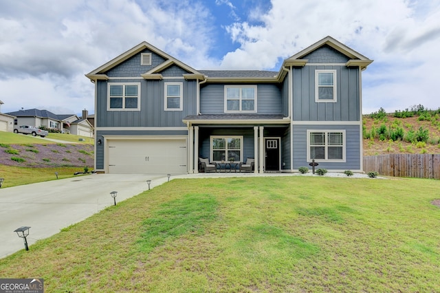 craftsman inspired home featuring a garage and a front yard