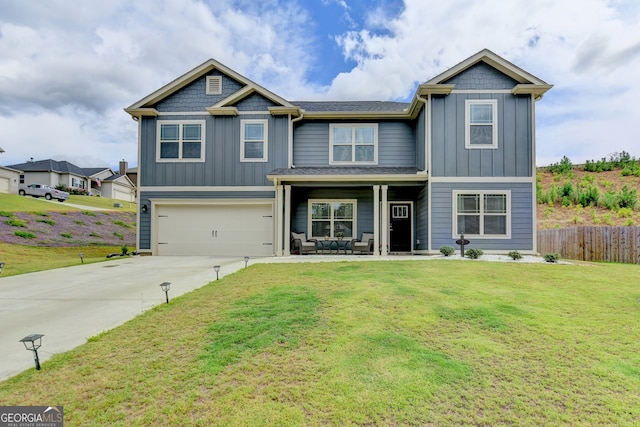 view of front of home featuring a front yard and a garage