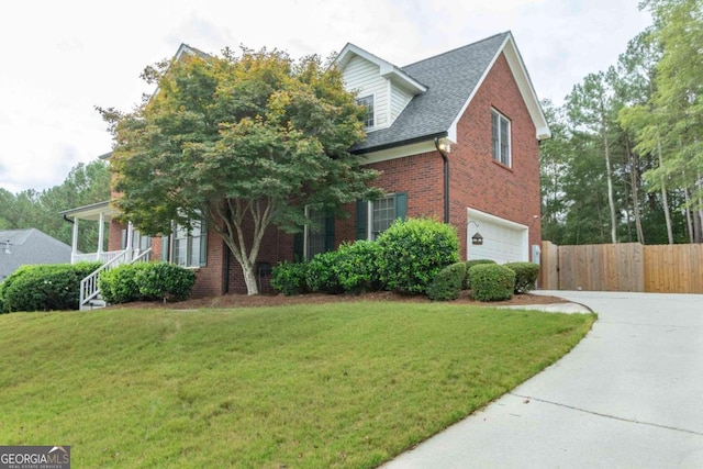 view of front of house with a garage and a front yard