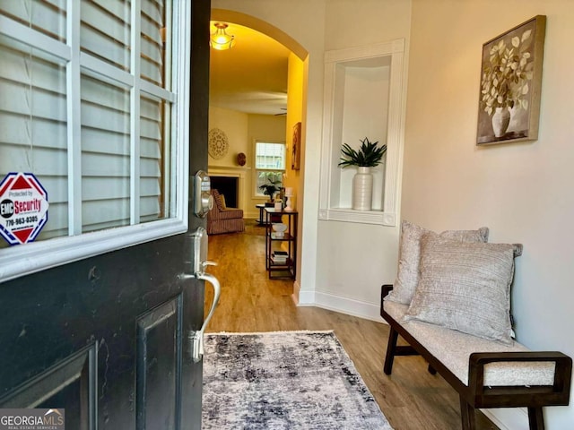 sitting room with wood-type flooring