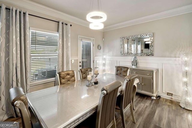 dining room featuring ornamental molding and dark wood-type flooring