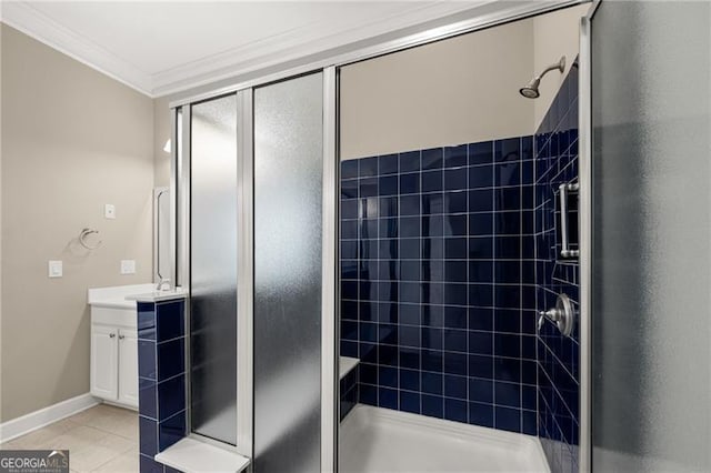 bathroom featuring walk in shower, ornamental molding, tile patterned flooring, and vanity