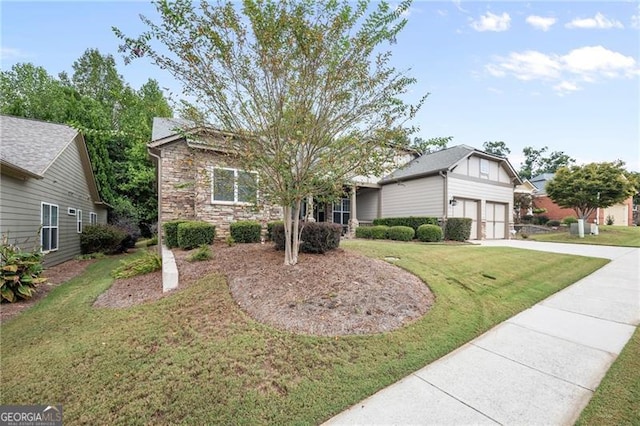 view of front of property with a garage and a front yard