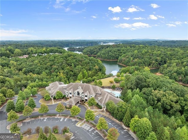 birds eye view of property with a water view