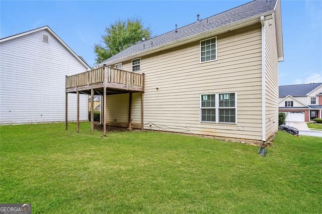 back of property featuring a lawn, central air condition unit, and a wooden deck