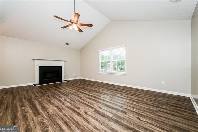 unfurnished living room featuring dark wood-type flooring, ceiling fan, and vaulted ceiling