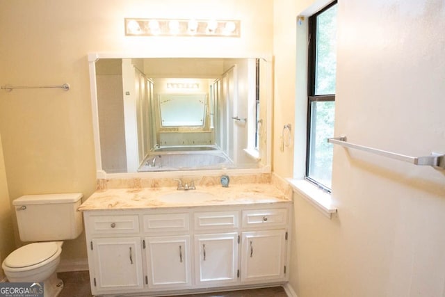 bathroom featuring vanity and toilet