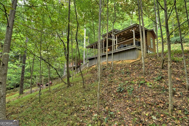 rear view of property with a deck