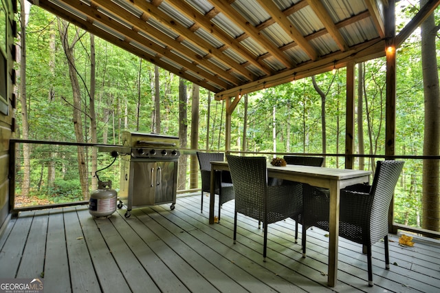 unfurnished sunroom featuring lofted ceiling