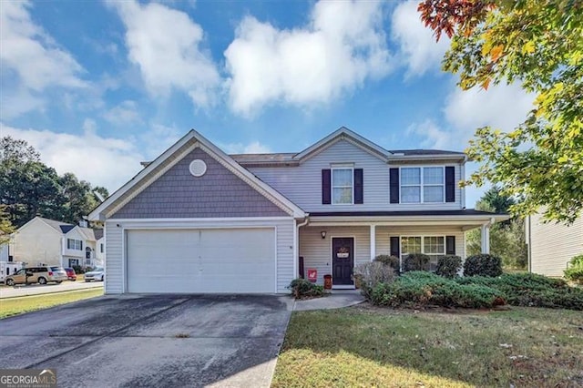 view of front of property featuring a porch, a garage, and a front lawn