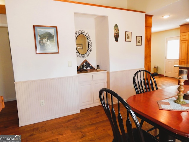 381 Hidden Lakeview Cir, Hiawassee, GA 30546 - dining room with wood finished floors, a wainscoted wall, and wooden walls