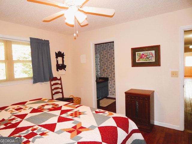 381 Hidden Lakeview Cir, Hiawassee, GA 30546 - bedroom with wood finished floors, connected bathroom, a textured ceiling, baseboards, and ceiling fan