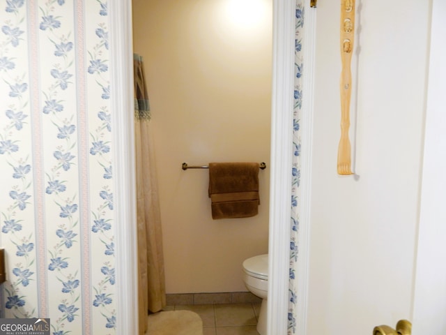 bathroom with tile patterned floors and toilet