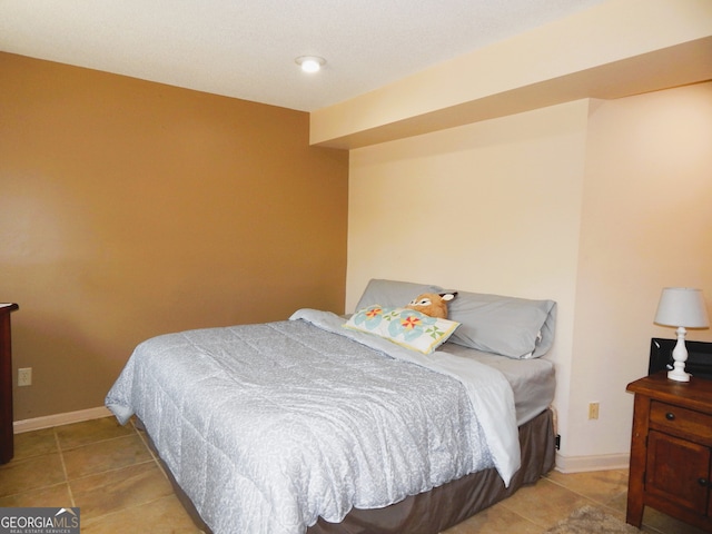 bedroom featuring light tile patterned flooring