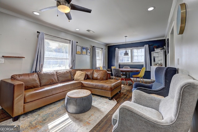 living room featuring ceiling fan, dark hardwood / wood-style floors, and crown molding