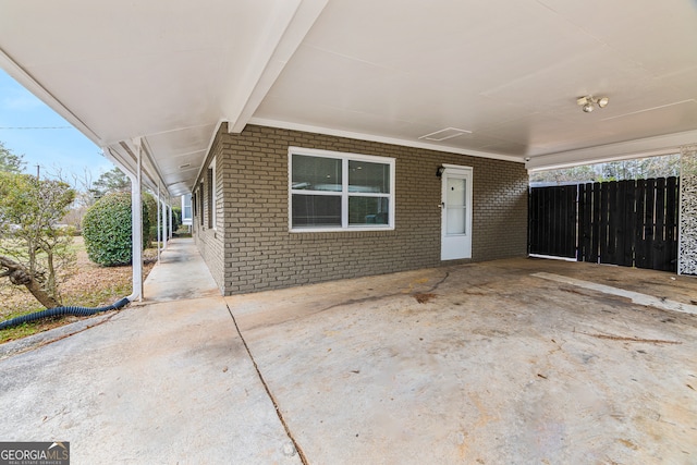 exterior space featuring a carport