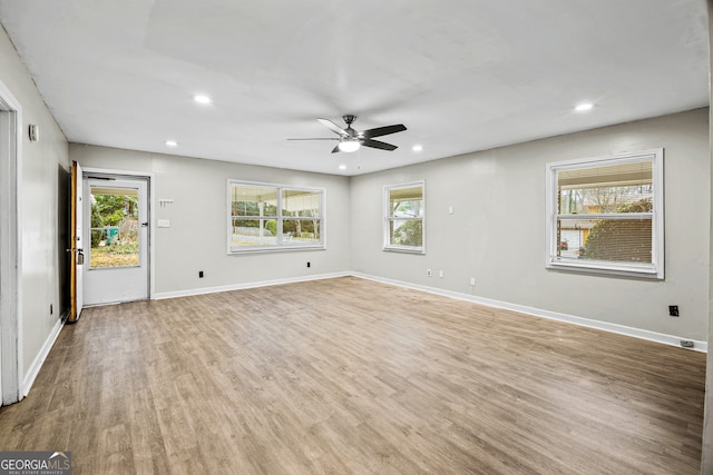 unfurnished room featuring ceiling fan and light wood-type flooring