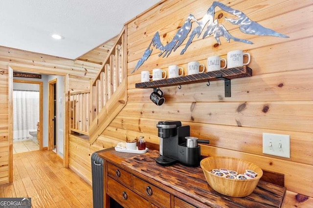 interior space with wooden walls and hardwood / wood-style flooring