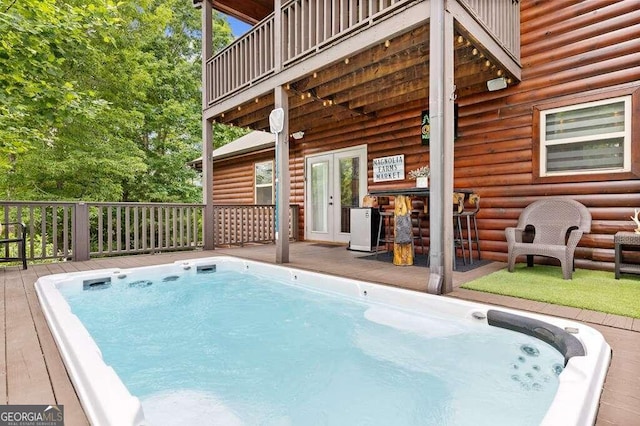 view of pool with a wooden deck