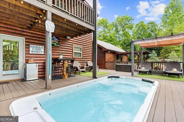 view of pool featuring a deck