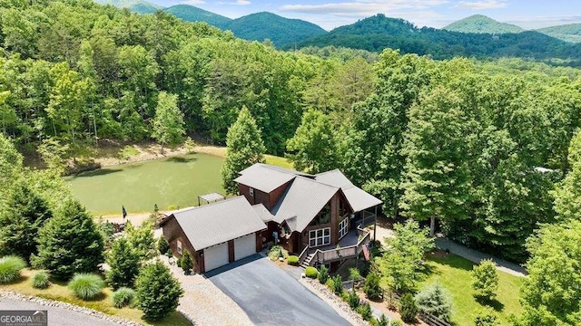 drone / aerial view featuring a water and mountain view