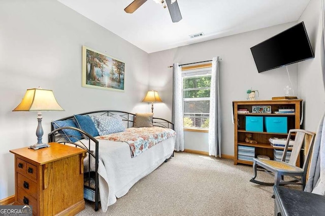 carpeted bedroom featuring ceiling fan