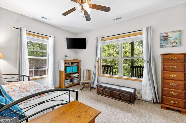 bedroom featuring ceiling fan and light colored carpet