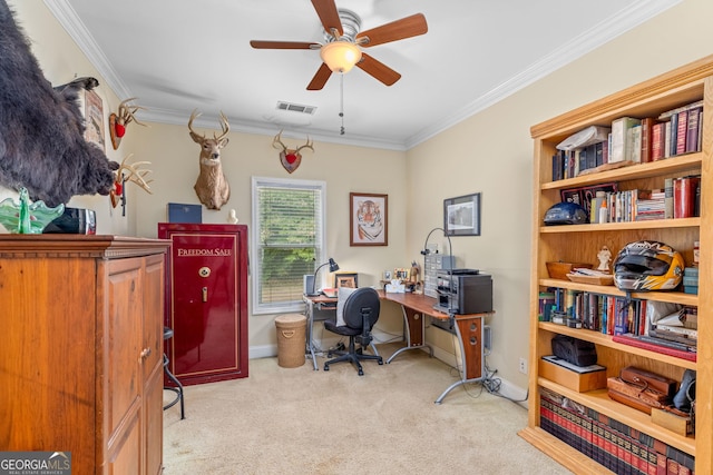 carpeted office with crown molding and ceiling fan