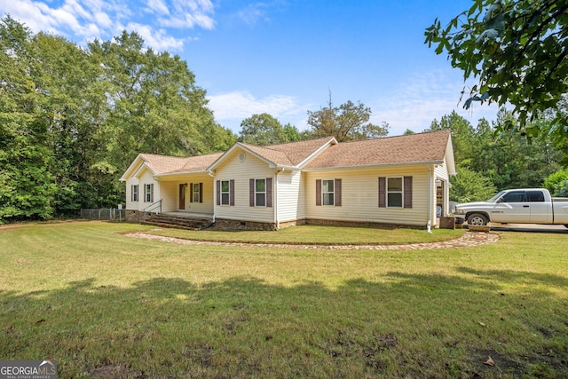 single story home featuring a front lawn