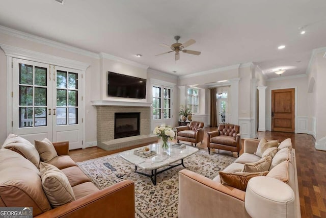 living room with ceiling fan, light wood-type flooring, and a healthy amount of sunlight