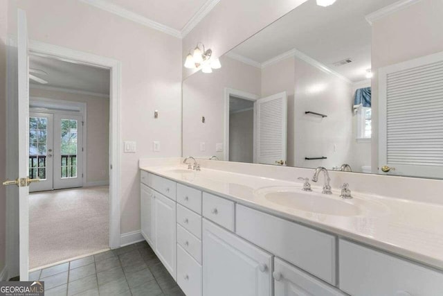 bathroom featuring french doors, tile patterned flooring, vanity, and crown molding