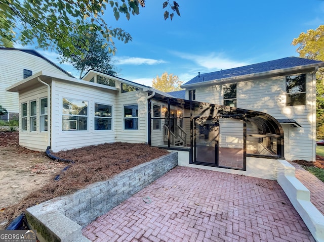 rear view of house featuring a patio area