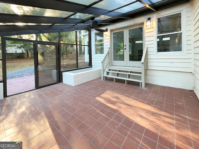 unfurnished sunroom featuring french doors