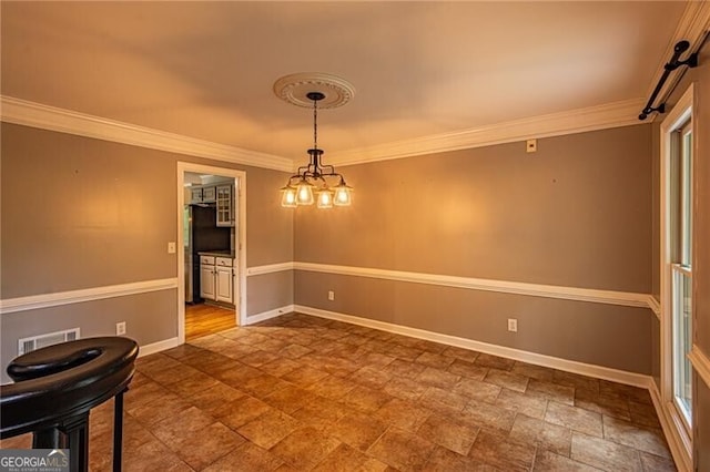 interior space featuring a chandelier and crown molding