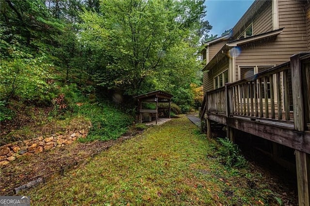 view of yard with a wooden deck