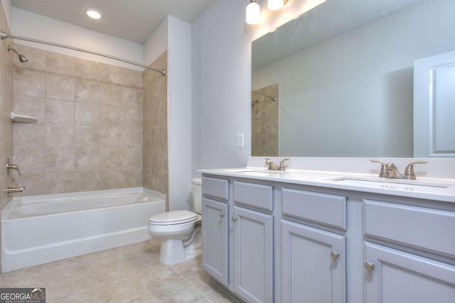 bathroom with a sink, double vanity, toilet, bathing tub / shower combination, and tile patterned flooring