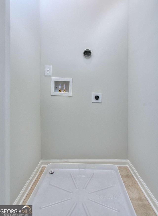 clothes washing area with hookup for a washing machine, electric dryer hookup, laundry area, and baseboards
