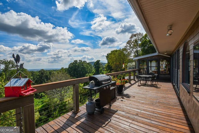 deck featuring a grill