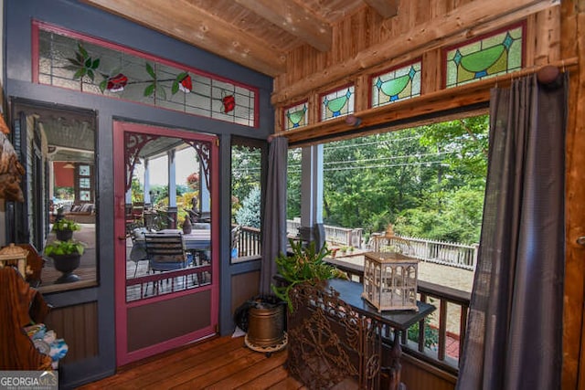 sunroom with wood ceiling and beam ceiling