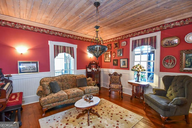 living room with wood ceiling, dark wood-type flooring, and crown molding