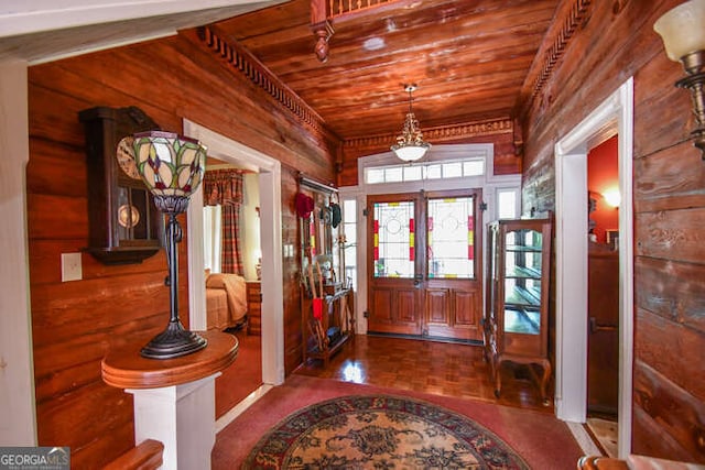 entrance foyer featuring wooden ceiling and french doors