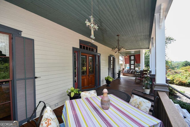 wooden terrace featuring covered porch