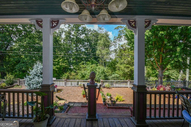 wooden deck featuring ceiling fan