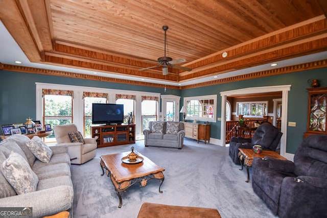 carpeted living room featuring ceiling fan, a raised ceiling, and wooden ceiling