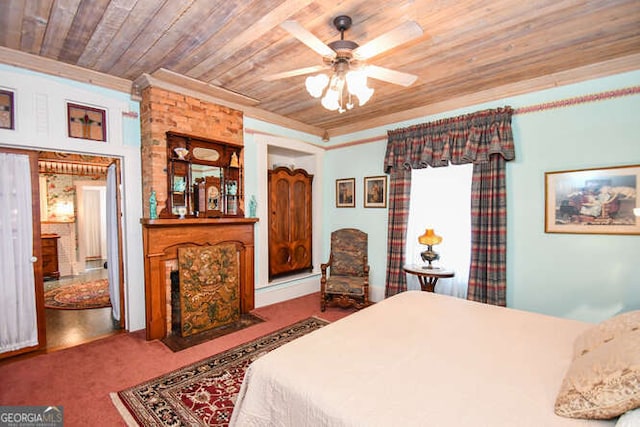 bedroom with ceiling fan, carpet floors, ornamental molding, and wooden ceiling