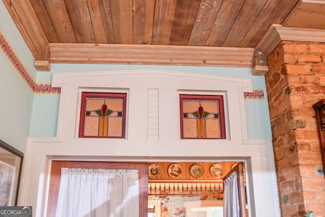 details featuring crown molding and wood ceiling