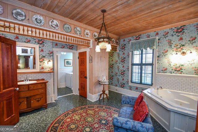 bathroom with crown molding, a bathing tub, wood ceiling, and vanity