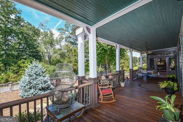 wooden terrace featuring covered porch