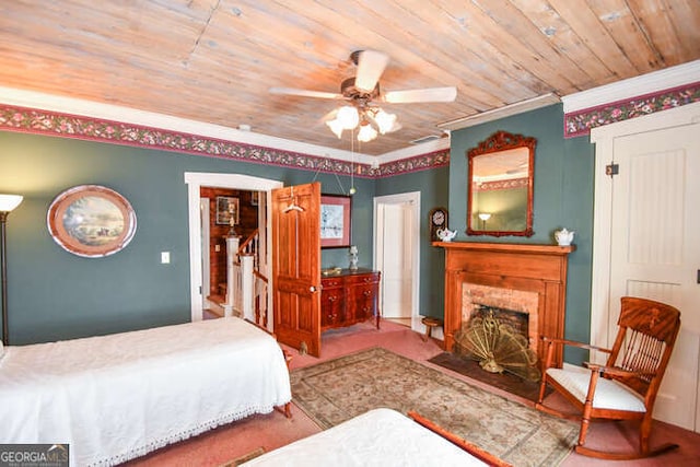 bedroom featuring wood ceiling, ceiling fan, and ornamental molding