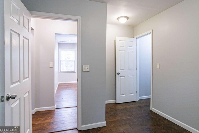 2836 Harlan Dr, Atlanta, GA 30344 - hallway featuring dark wood-type flooring and baseboards